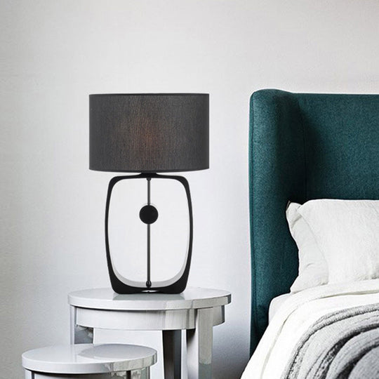 Minimalist Black Fabric Table Lamp With Round Shape And Open Base