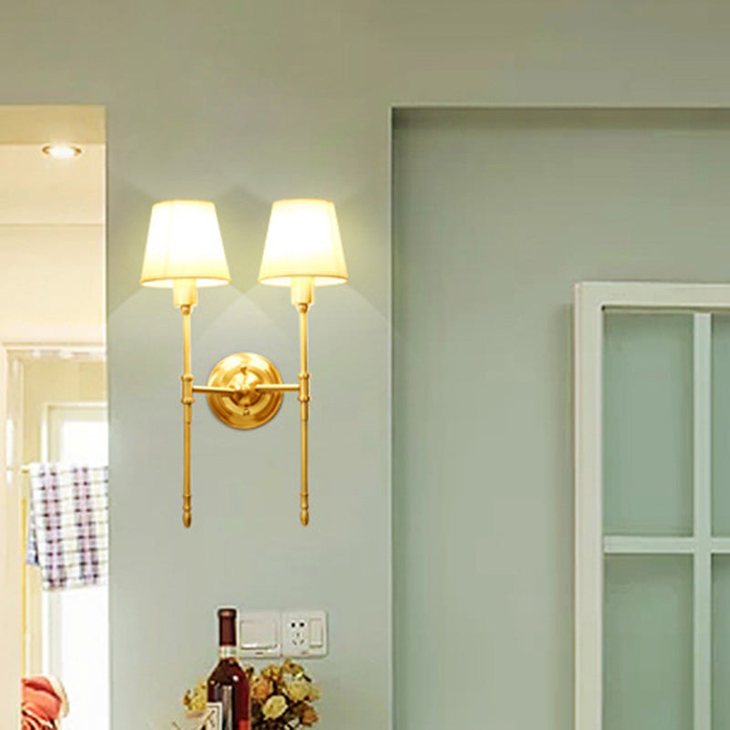 Golden Fabric Wall Sconce With Elongated Arm For Simplistic Bedroom Lighting