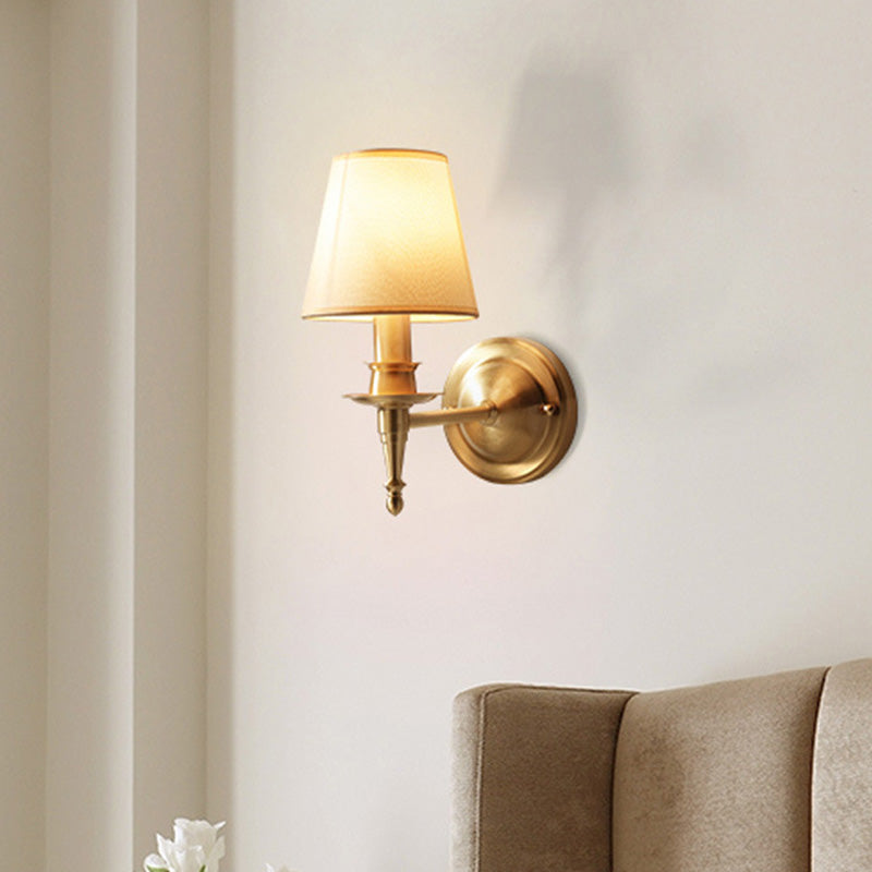 Gold Cone Wall Sconce With Single-Bulb Fabric Mount For Minimalist Lighting