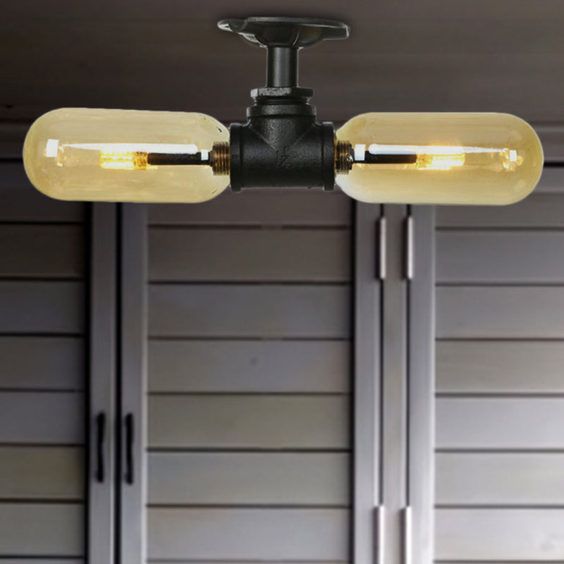 Rustic 2-Bulb Amber Glass Semi Mount Ceiling Light in Matte Black - Dining Room Lighting with Oval Shade and Pipe Design