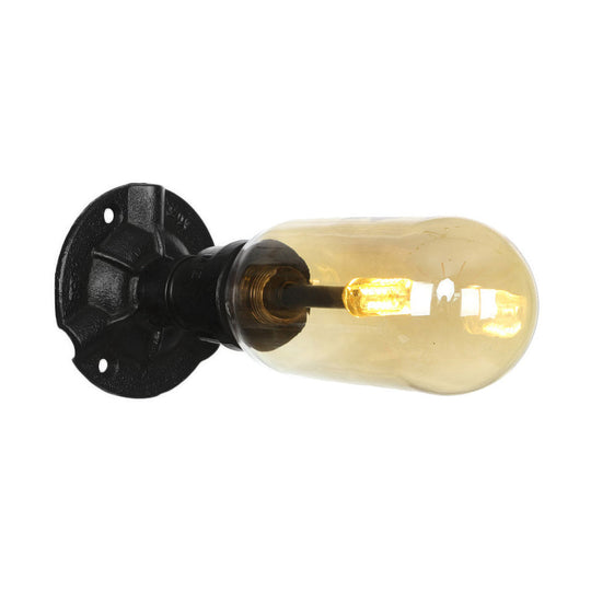 Industrial Dining Room Wall Sconce Lighting Fixture In Black - Amber Glass Capsule With Pipe Design