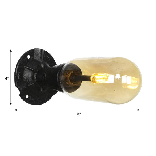 Industrial Dining Room Wall Sconce Lighting Fixture In Black - Amber Glass Capsule With Pipe Design