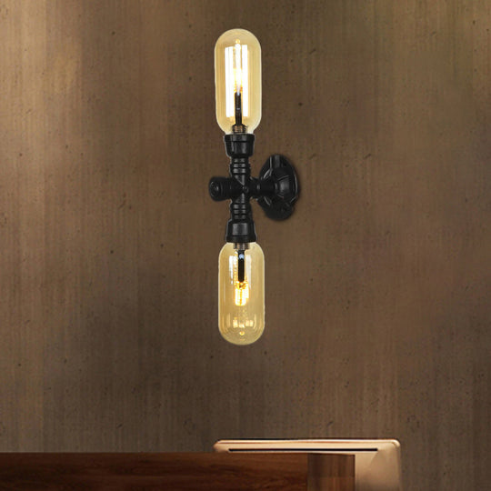 Industrial Dining Room Wall Sconce Lighting Fixture In Black - Amber Glass Capsule With Pipe Design