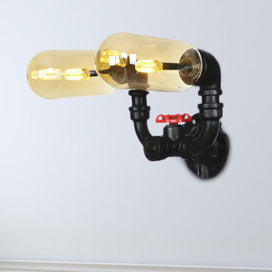 Industrial Dining Room Wall Sconce Lighting Fixture In Black - Amber Glass Capsule With Pipe Design