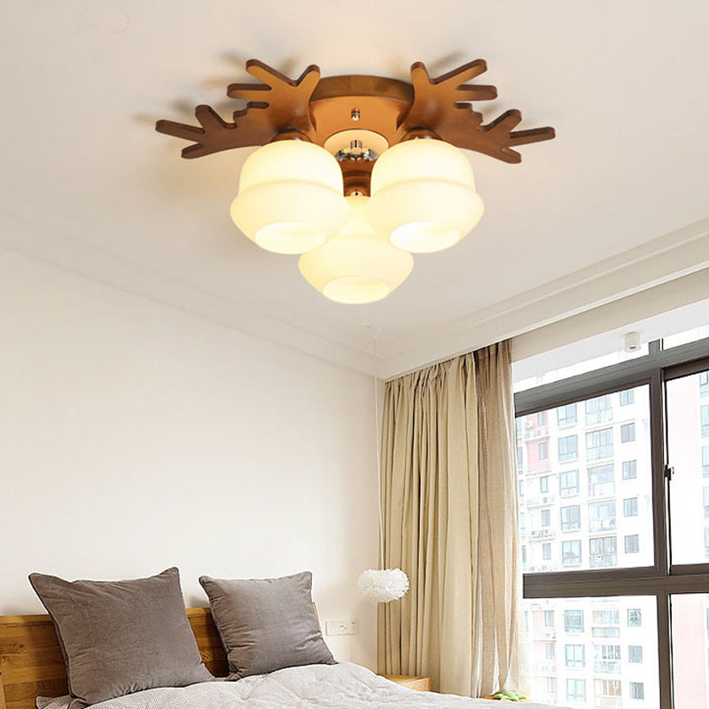 Nordic-style Wood Flush Ceiling Light with Antler Design and White Glass Shade