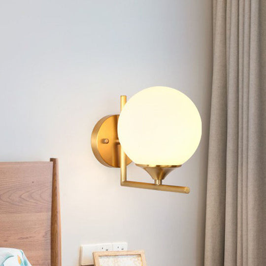 Minimalist Gold Sphere Bedside Wall Sconce - 1-Light Milk Glass Mounted Light With Right Angle Arm