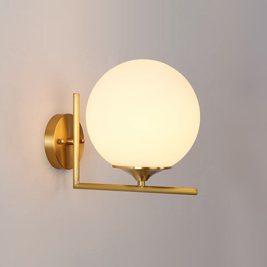 Minimalist Gold Sphere Bedside Wall Sconce - 1-Light Milk Glass Mounted Light With Right Angle Arm /