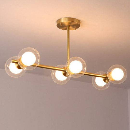 Brass Finish 6-Light Postmodern Linear Island Pendant With Glass Ball Shade