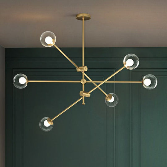 Minimalist Brass Finish Chandelier With Swivel Arm And Glass Shade