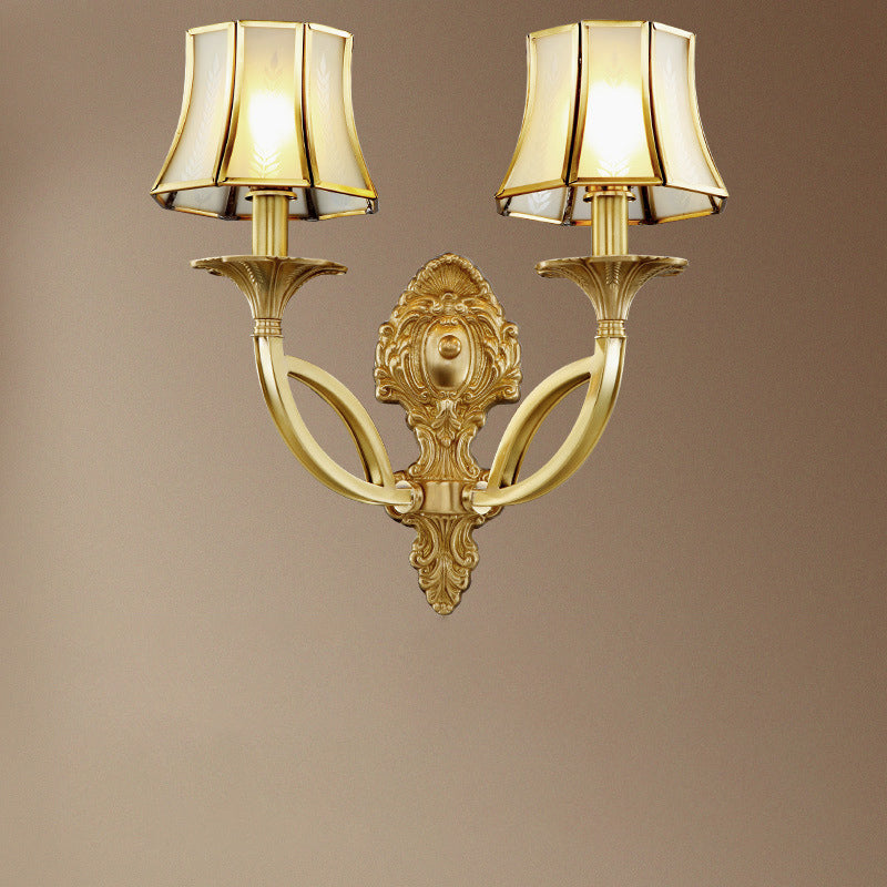 Frosted Glass Wall Sconce With Brass Paneled Bell And Scrolled Arm For Traditional Living Room Décor