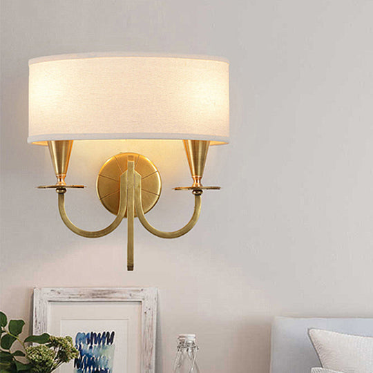 Vintage Brass Cylinder Wall Sconce With Fabric Shade And Arched Metal Arm - Ideal For Bedroom