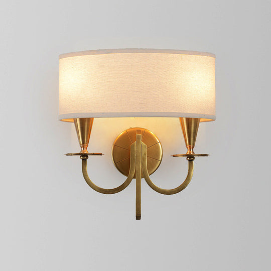 Vintage Brass Cylinder Wall Sconce With Fabric Shade And Arched Metal Arm - Ideal For Bedroom