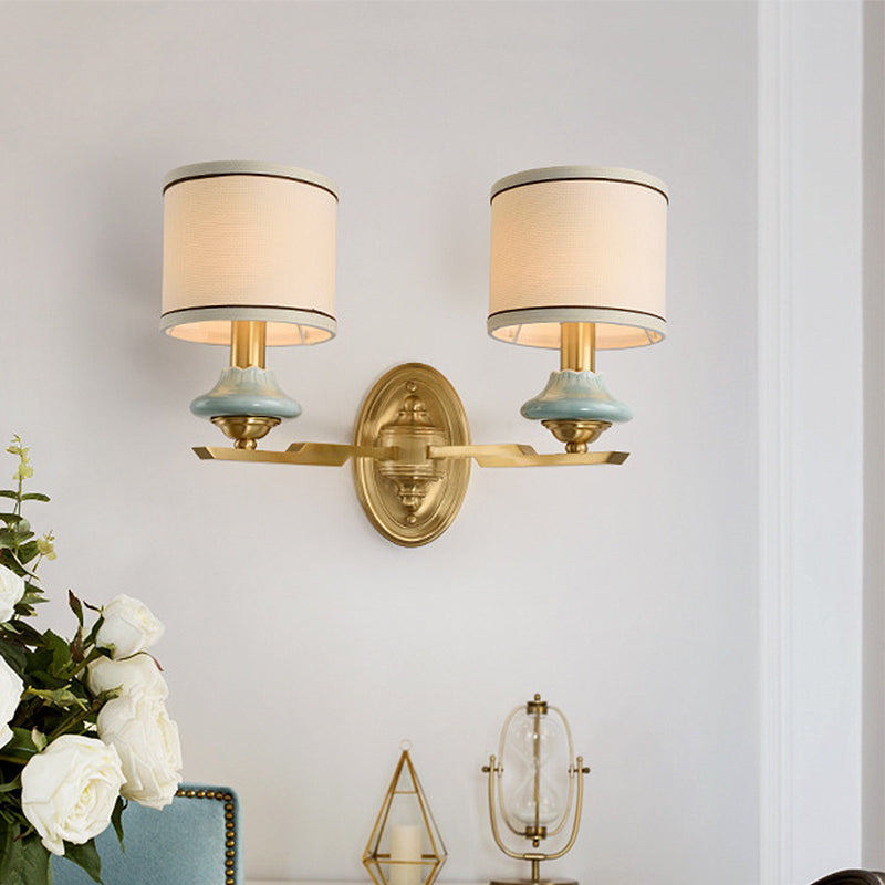 Retro Gold Fabric Wall Sconce With Porcelain Cap - Cylindrical 1/2-Light Lamp For Porch