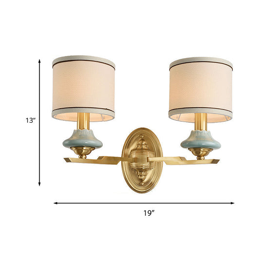 Retro Gold Fabric Wall Sconce With Porcelain Cap - Cylindrical 1/2-Light Lamp For Porch