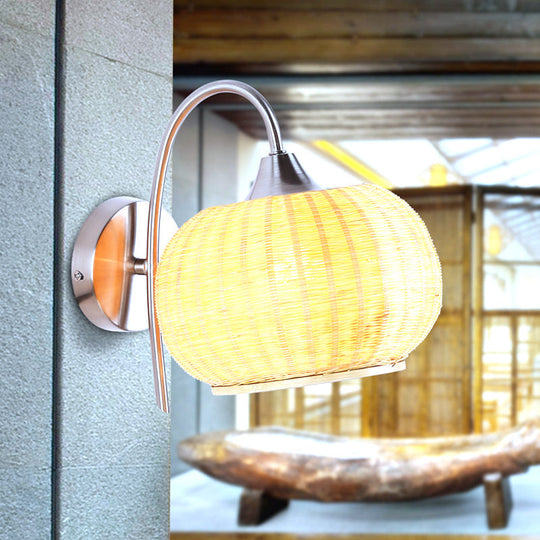 Modern Rattan Drum Sconce Wall Light - Chrome Finish 1-Light Lamp With Curved Metal Arm