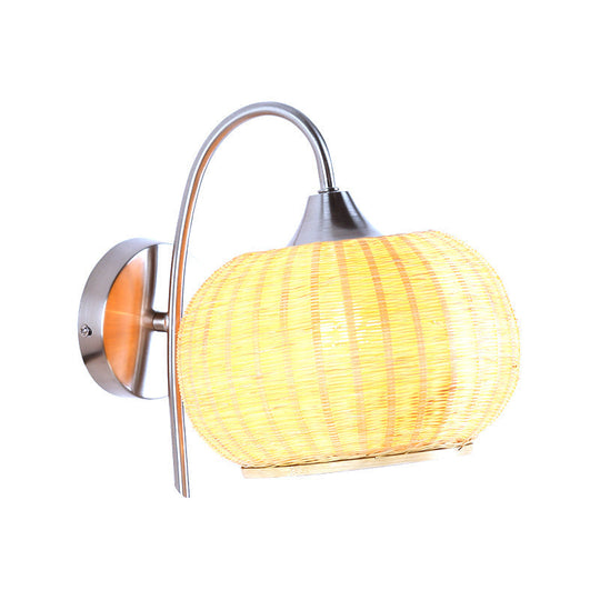 Modern Rattan Drum Sconce Wall Light - Chrome Finish 1-Light Lamp With Curved Metal Arm