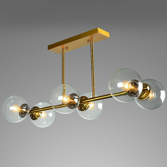 Postmodern Brass Island Light With Globe Glass Shade: Stylish Metal Ceiling Fixture