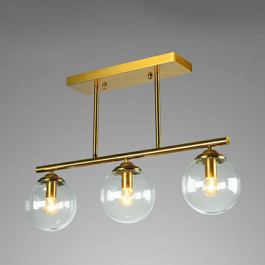 Postmodern Brass Island Light With Globe Glass Shade: Stylish Metal Ceiling Fixture 3 / Clear