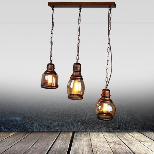 Rustic Clear Glass Pendant Light for Coffee Shop Ceiling - 1 Light, Rust Bottle Shade, Multi Pendant, Linear Canopy