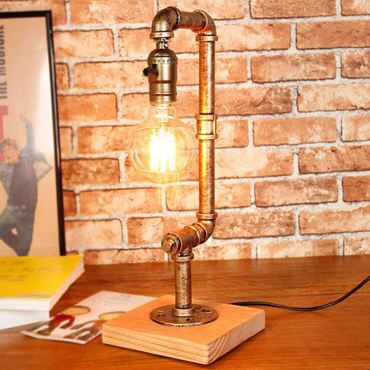 Rustic Wrought Iron Table Lamp With Stylish Open Bulb - Bedroom Lighting In Bronze