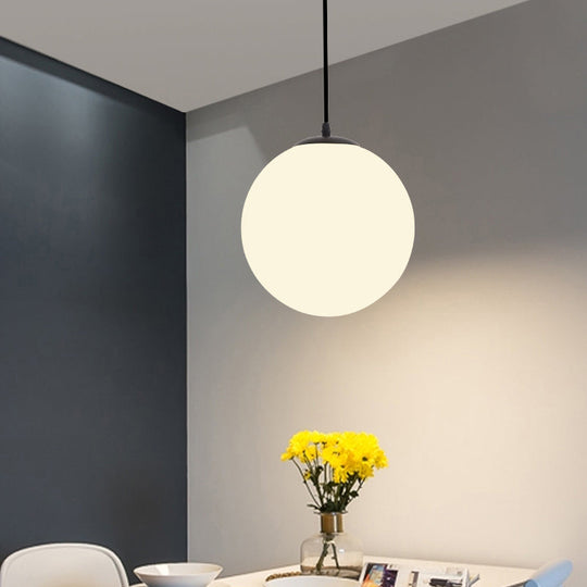 Sleek Black Sphere Restaurant Pendant Light with Cream Glass Shade - Simple Ceiling Hang Lamp