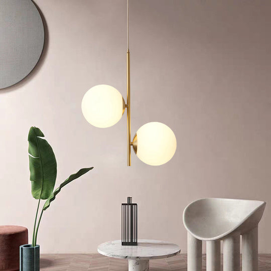 Modern Gold Suspended Light Fixture With Opaque Glass Spheres - Ideal For Dining Room Décor