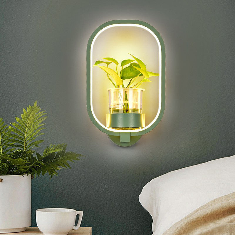 Modern Metal Wall Sconce With Artistic Loop Design And Clear Glass Plant Pot Green / Third Gear