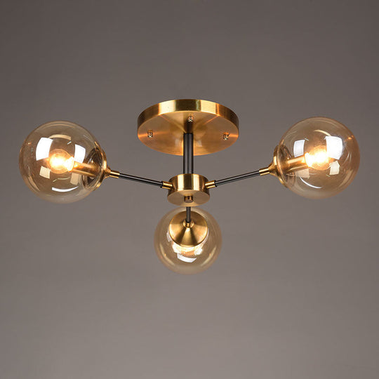 Postmodern Brass Flush Mount Light with Burst Design and Glass Ball for Living Room