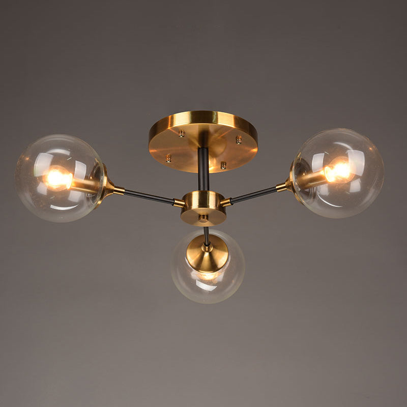 Postmodern Brass Flush Mount Light with Burst Design and Glass Ball for Living Room