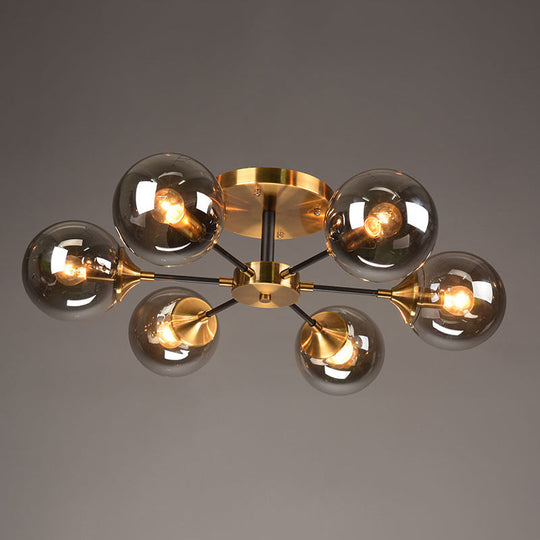 Postmodern Brass Flush Mount Light with Burst Design and Glass Ball for Living Room