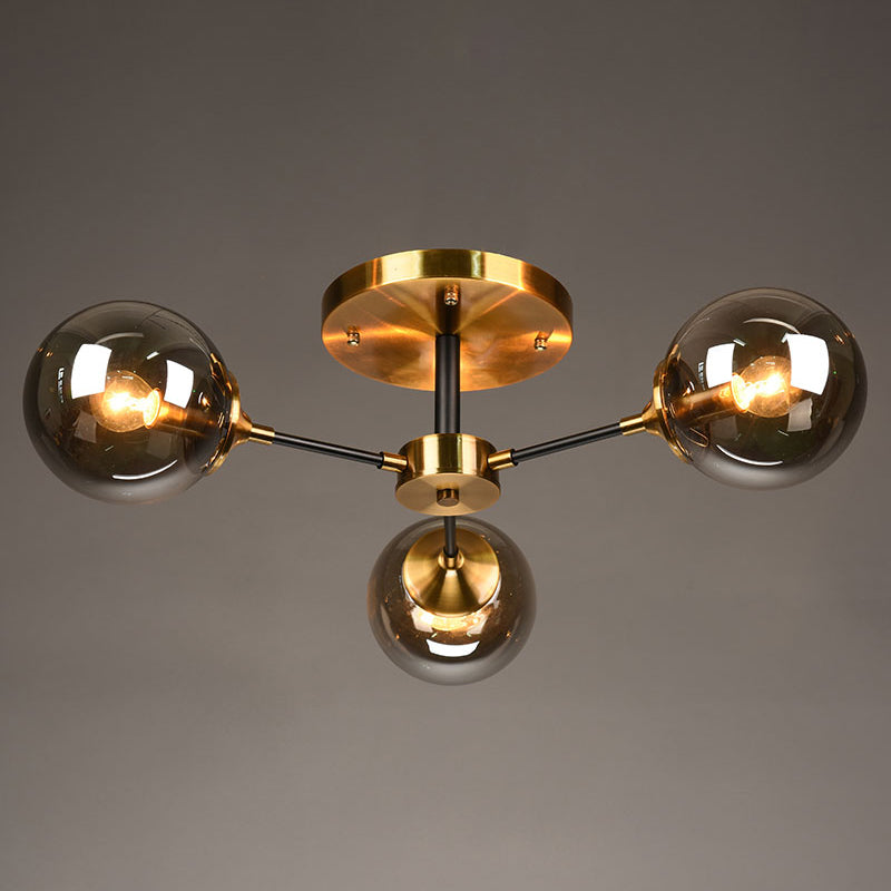 Postmodern Brass Flush Mount Light with Burst Design and Glass Ball for Living Room