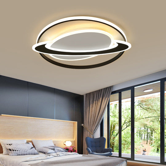 Cosmic Bedroom Glow: Black-White Acrylic LED Flush Mount Ceiling Light with a Ringed Planet Design