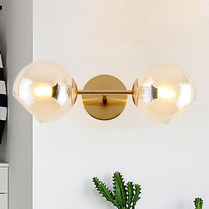 Modernist Gold Wall Lamp With Clear Glass Shade - 2 Lights Spherical Mount Fixture