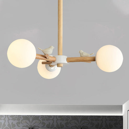 Japanese-Inspired Bedroom Chandelier with Orb Shade, Birds, Wood, and Glass in White