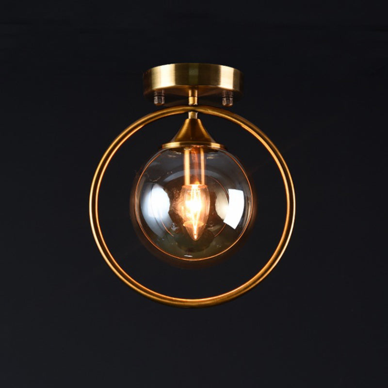 Postmodern Glass Ball Ceiling Light With Brass Metal Ring - 1-Light Semi-Flush Mount For Corridors