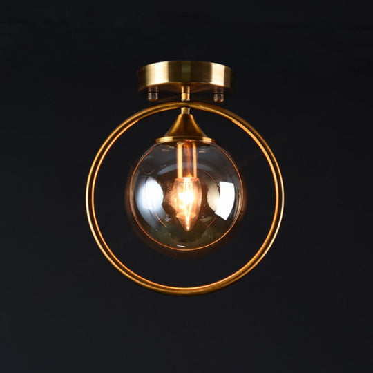 Postmodern Glass Ball Ceiling Light With Brass Metal Ring - 1-Light Semi-Flush Mount For Corridors