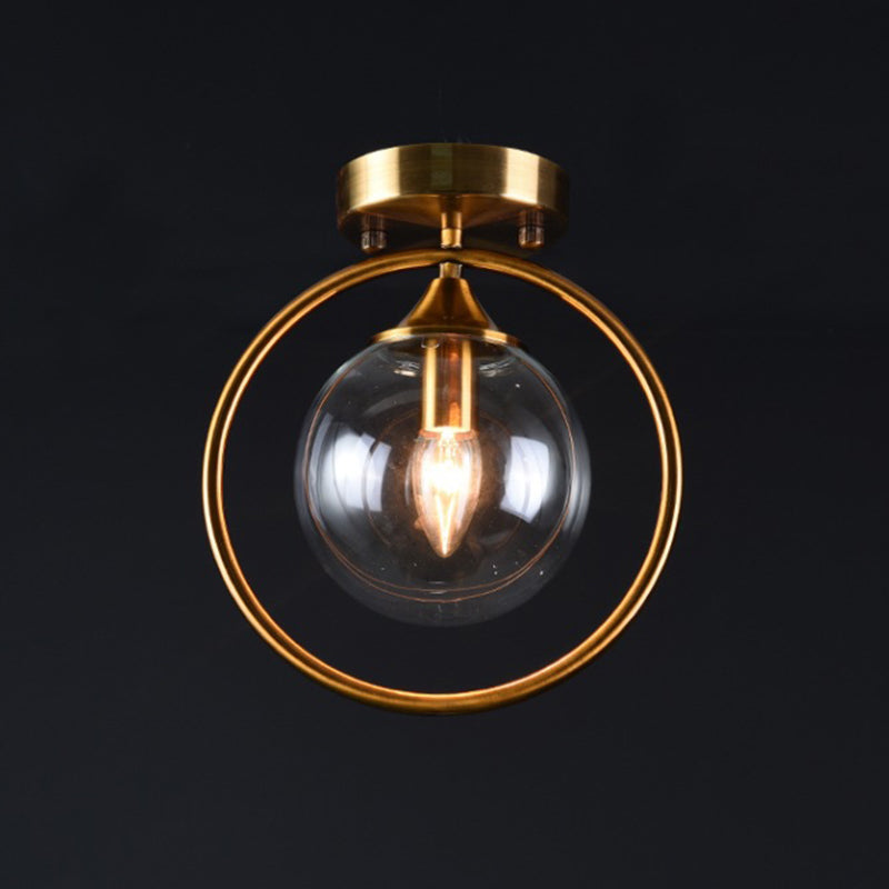 Postmodern Glass Ball Ceiling Light With Brass Metal Ring - 1-Light Semi-Flush Mount For Corridors