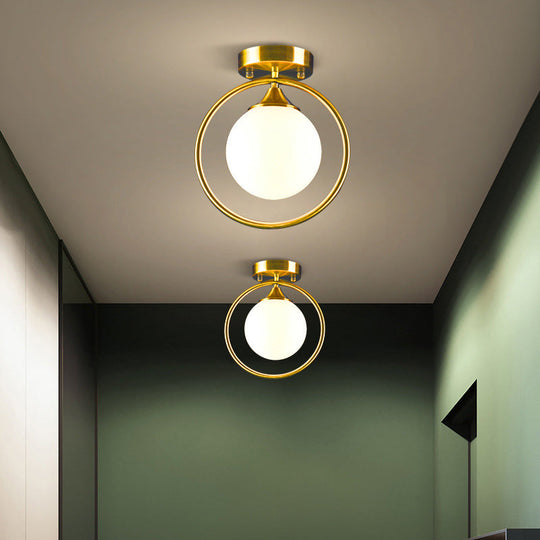 Postmodern Glass Ball Ceiling Light With Brass Metal Ring - 1-Light Semi-Flush Mount For Corridors