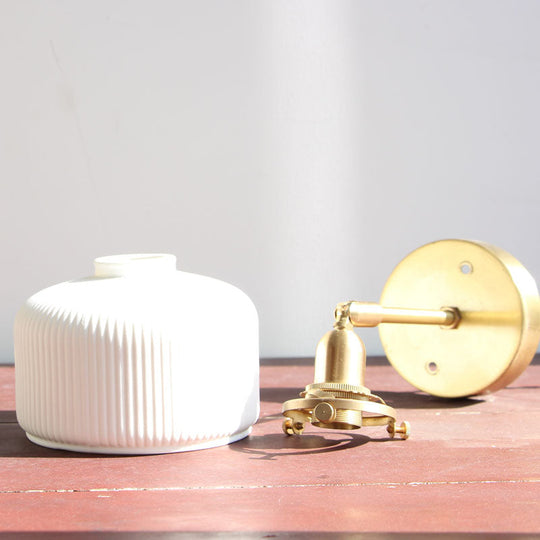 Brass Pivot Joint Foyer Sconce: Round Ribbed Glass Wall Light With White Simplicity (1 Bulb)