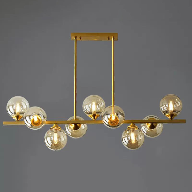 Mid-Century Modern Gold Metal Pendant With Spherical Amber Glass - Island Ceiling Light For Dining