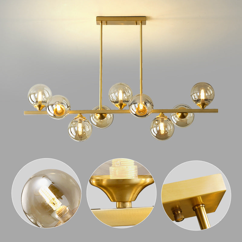 Mid-Century Modern Gold Metal Pendant With Spherical Amber Glass - Island Ceiling Light For Dining