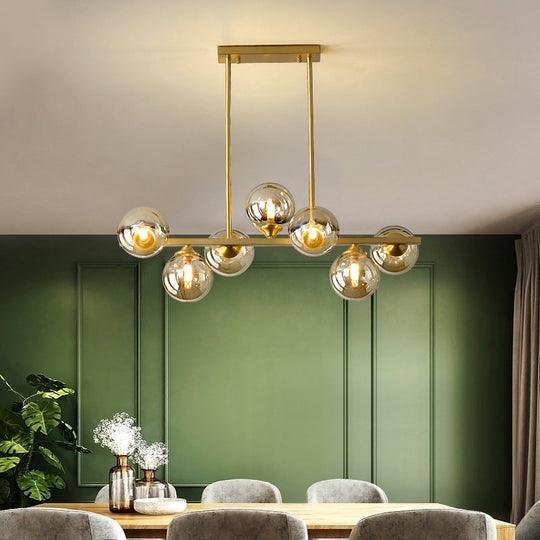 Mid-Century Modern Gold Metal Pendant With Spherical Amber Glass - Island Ceiling Light For Dining