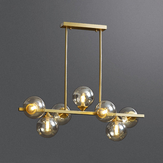 Mid-Century Modern Gold Metal Pendant With Spherical Amber Glass - Island Ceiling Light For Dining