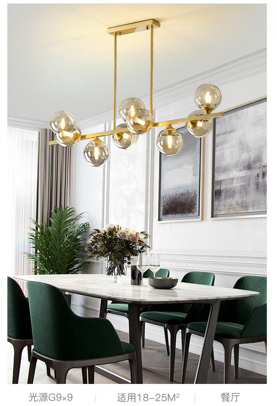 Mid-Century Modern Gold Metal Pendant With Spherical Amber Glass - Island Ceiling Light For Dining