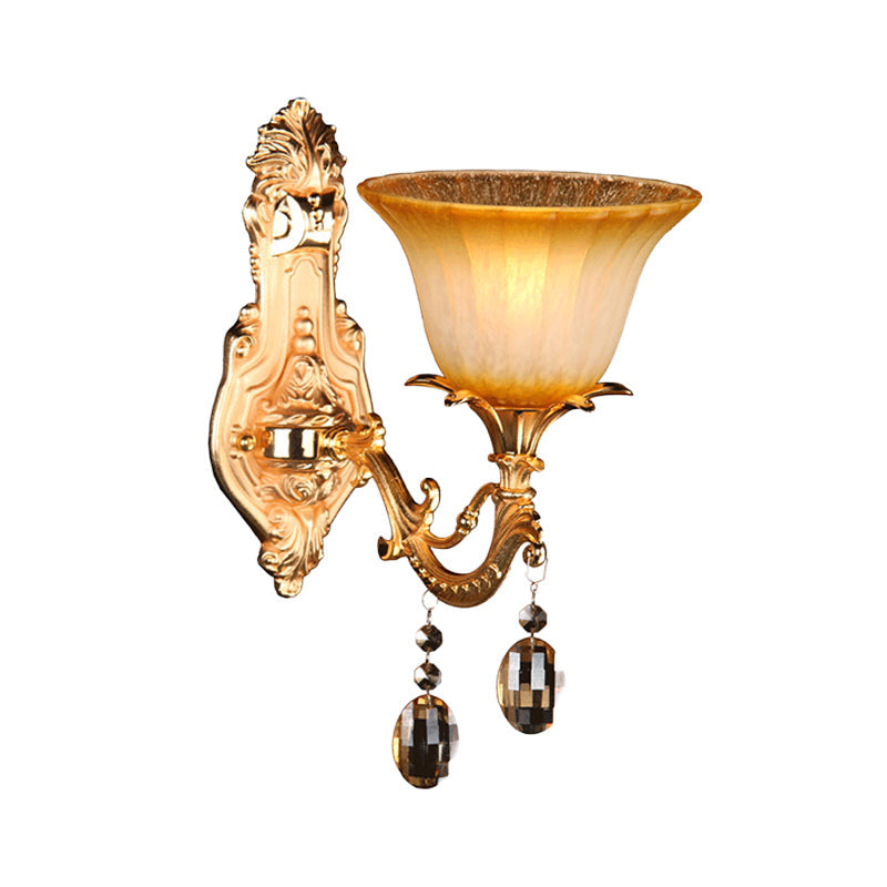 Amber Glass Wall Sconce With Brass Flower Detail For Traditional Bedroom Lighting