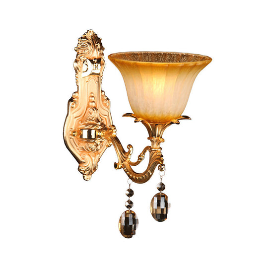 Amber Glass Wall Sconce With Brass Flower Detail For Traditional Bedroom Lighting