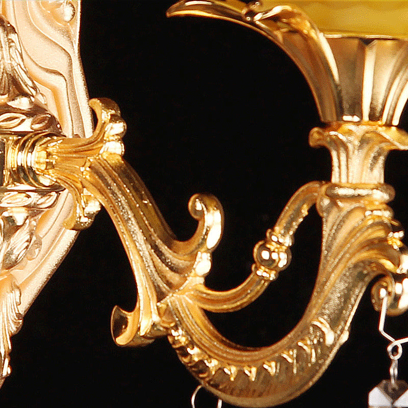 Amber Glass Wall Sconce With Brass Flower Detail For Traditional Bedroom Lighting