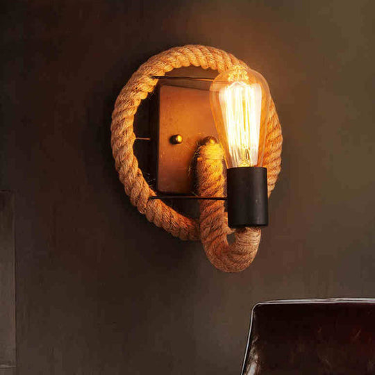 Rustic Indoor Wall Light With Wagon Wheel Design And Rope Shade