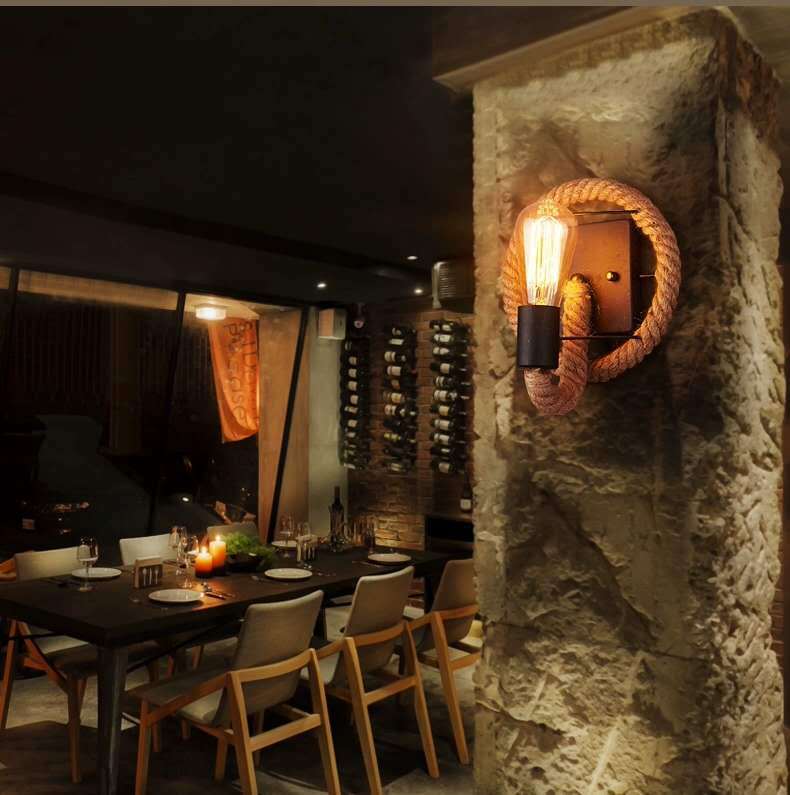 Rustic Indoor Wall Light With Wagon Wheel Design And Rope Shade