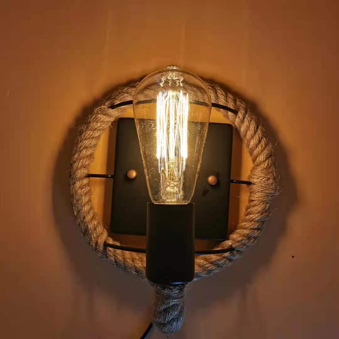 Rustic Indoor Wall Light With Wagon Wheel Design And Rope Shade